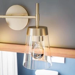 Delgato 2-Light Antique Brass Bathroom Vanity Light by Kenroy Home -Kenroy Home Sales antique brass and clear glass finish kenroy home vanity lighting 93982ab 1f 1000