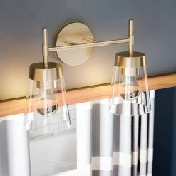 Delgato 2-Light Antique Brass Bathroom Vanity Light by Kenroy Home -Kenroy Home Sales antique brass and clear glass finish kenroy home vanity lighting 93982ab 44 1000