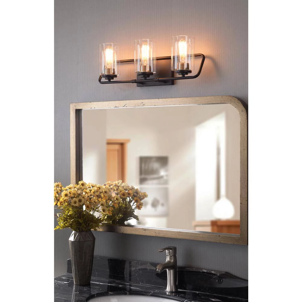 Carleigh 21 in. 3-Light Black and Antique Brass Vanity Light with Clear Glass Shades by Kenroy Home 4 Carleigh 21 in. 3-Light Black and Antique Brass Vanity Light with Clear Glass Shades by Kenroy Home - Image 2