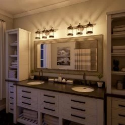 Cozy 3-Light Oil Rubbed Bronze Bathroom Vanity Light by Kenroy Home -Kenroy Home Sales wood and oil rubbed bronze finish kenroy home vanity lighting 94049orb 77 1000